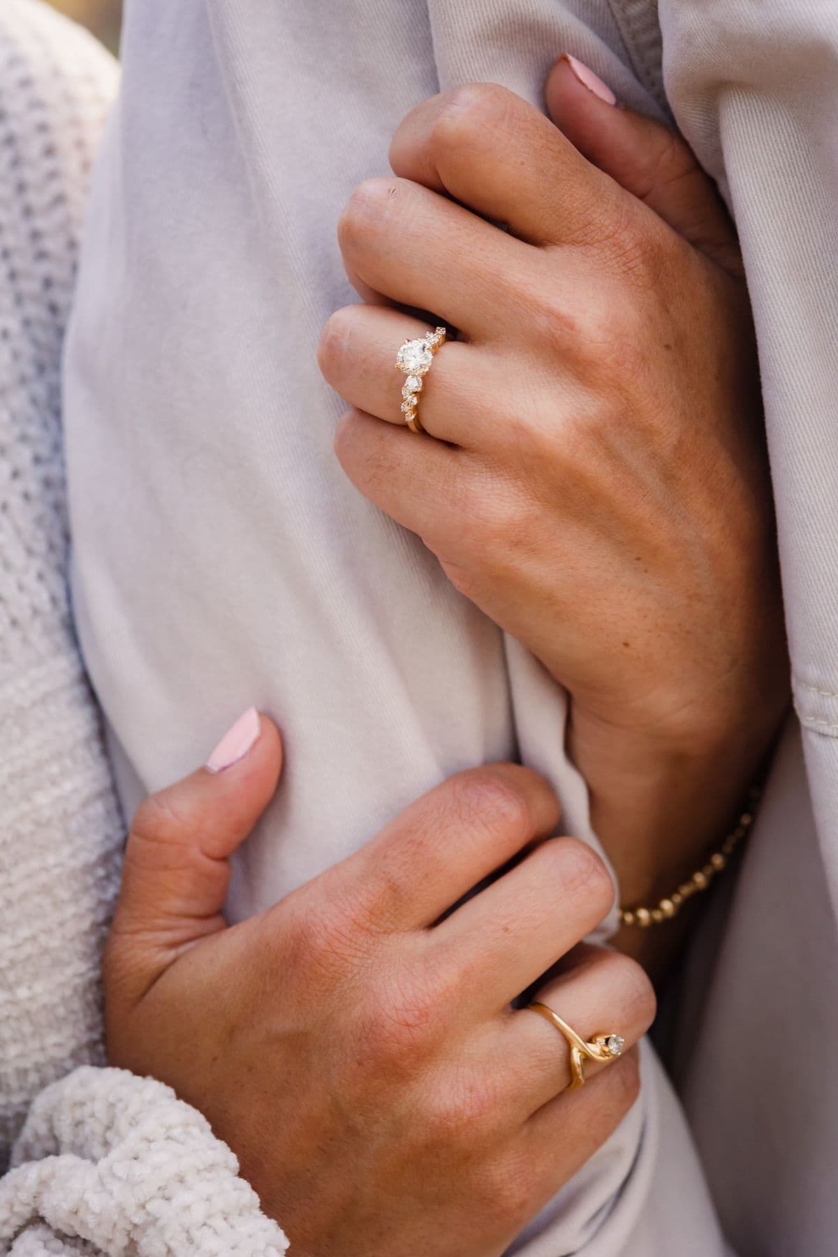 Close-up of an engagement ring and hands