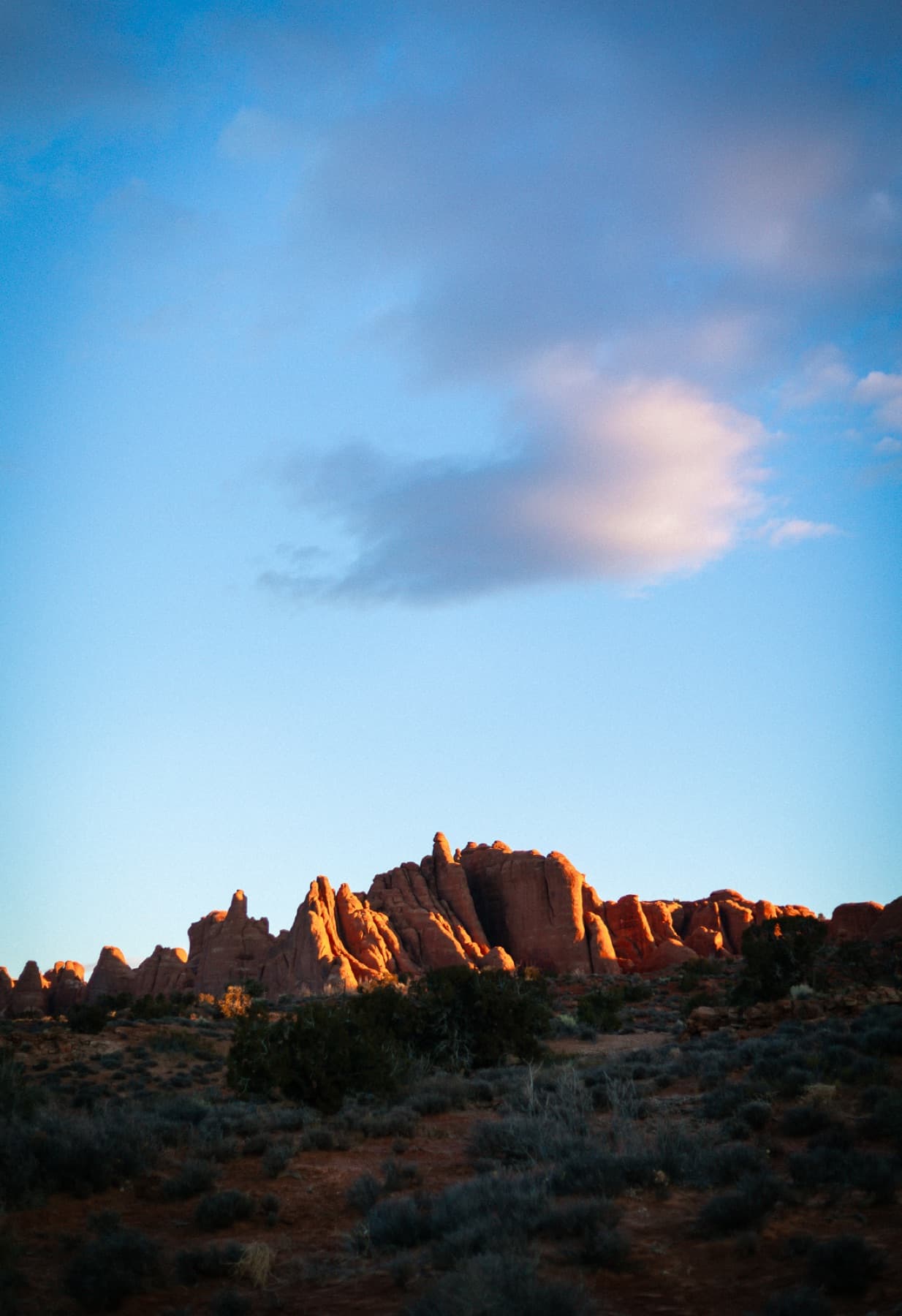 arches national park at sunrise of rockface vertical