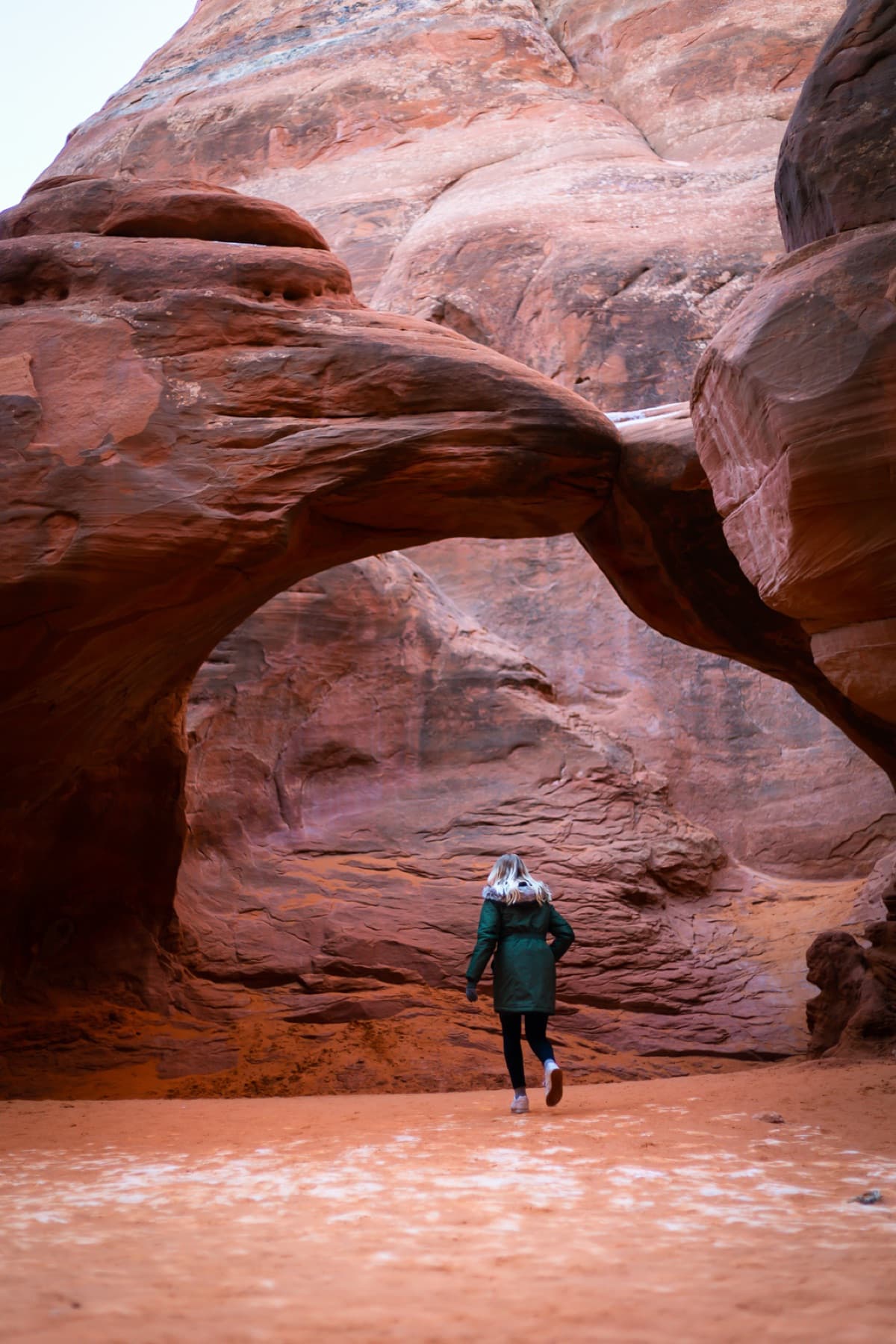 woman walking through arch arches np