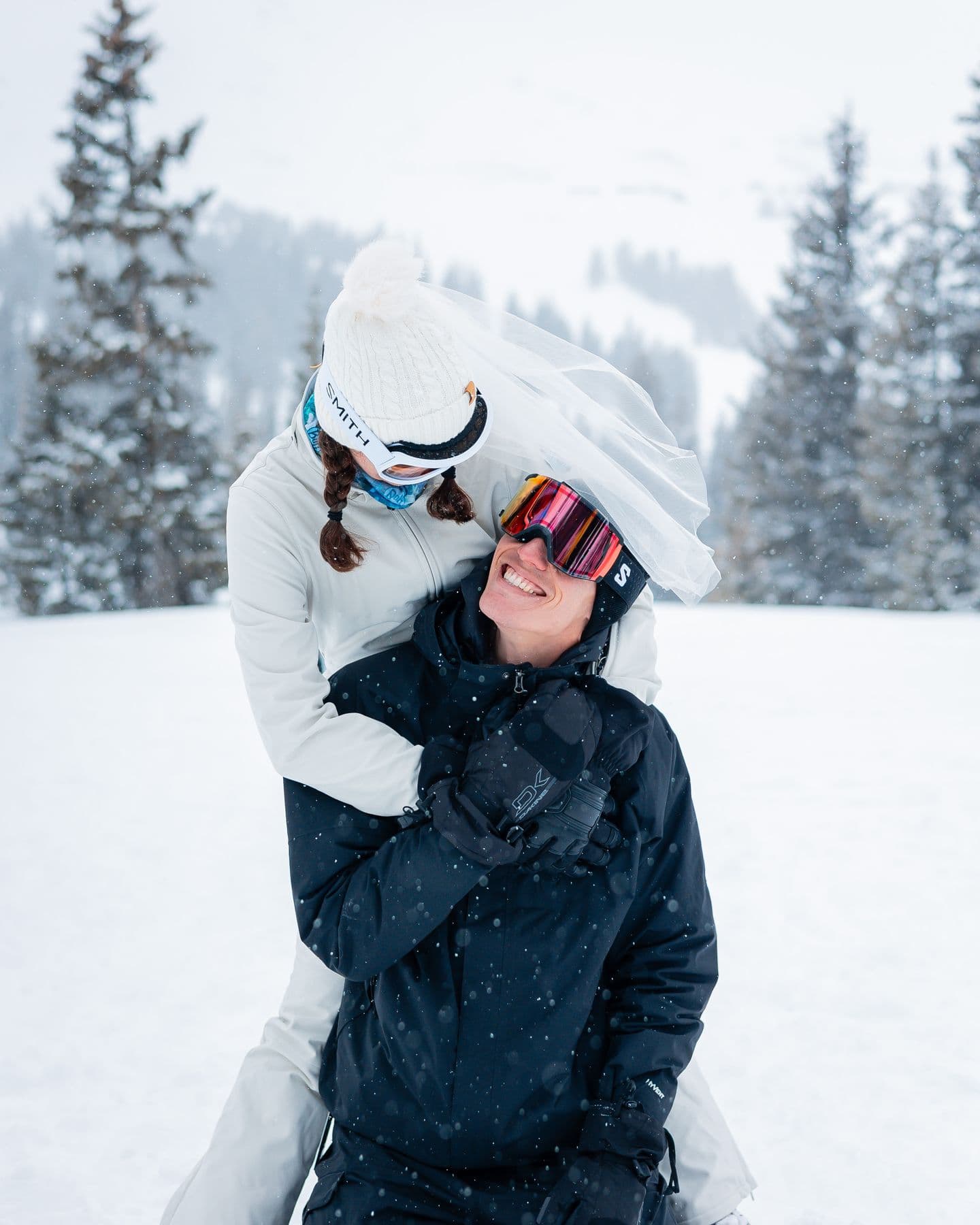 A happy couple during their snowy Colorado ski elopement